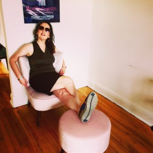 Sharon Hyman seated in her apartment