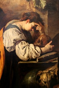 Painting of a man staring at a skull