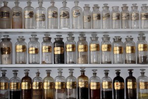 a photograph of shelves of Victorian medicine bottles