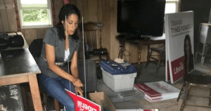Tamara Tynes Powell preparing a stack of campaign signs