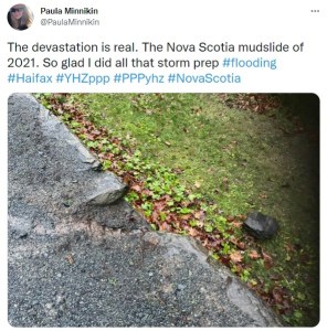 A tweet from Paula Minnikin that says the devastation is real. The Nova Scotia mudslide of 2021. So glad I did all that storm prep. The photo shows a rock ledge with a very small rock that broke away.