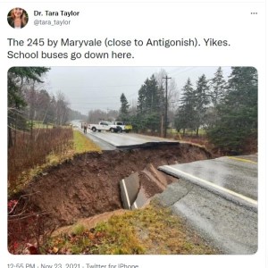 A tweet from Dr. Tara Taylor that says The 245 by Maryvale close to Antigonish. Yikes. School Buses down there. The photo shows highway 245 with a section completed washed out from the rain. Trucks are parked nearby.
