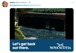 An ad with the slogan lets get out there showing Pennywise the evil killer clown peering out from the sewer