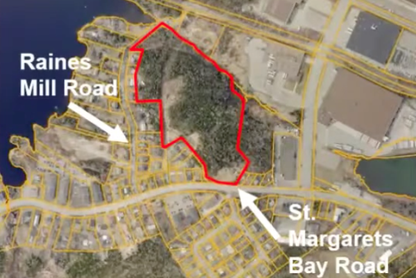 An annotated map is shown, with a property highlighted in red. On the bottom, the map says "St. Margaret's Bay Road" with an arrow pointing up to a road. On the top, "Raines Mill Road," with an arrow pointing down to a road. There's a body of water in the upper lefthand corner.