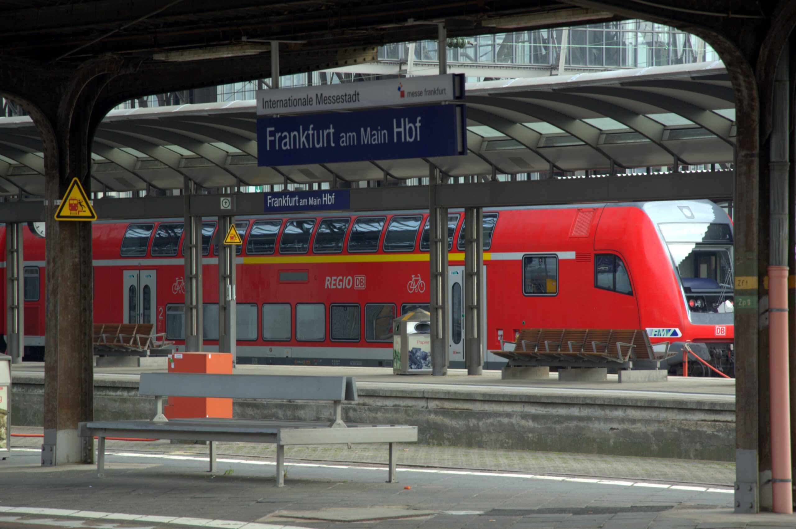 A train stopped at a station platform in Germany.