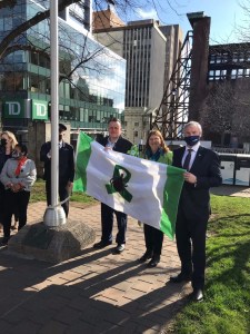 Unfurling of Lyme Awareness flag May 3 with Mayor Mike Savage Donna Lugar and PC MLA Steve Craig. The flag was designed by Lyme activist Brenda Sterling-Goodwin with creative designer John Ashton, input from the Nova Scotia Lyme Advocacy Group, and made by Janelle Clyke. Photo Brian Lugar