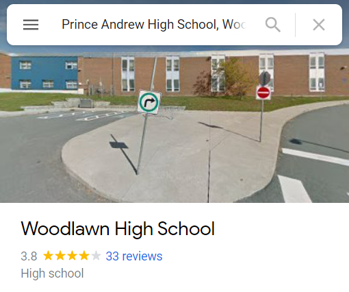 Screenshot from Google Maps showing the front of a brick building. The search bar says Prince Andrew High School, while the text under the image says Woodlawn High School.