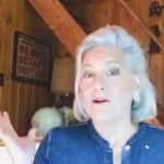 a white woman with chin length silver hair